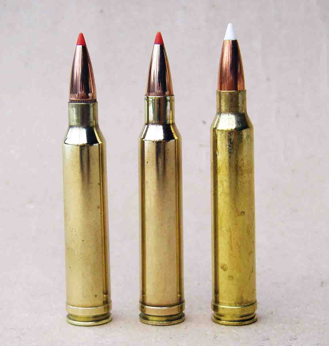Many people expected Winchester to neck down the .338 Winchester Magnum case to create its .30-caliber magnum. However, Winchester chose to move the shoulder forward and increase powder capacity. Shown from left is the .30-338 wildcat, .308 Norma Magnum and .300 Winchester Magnum.